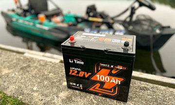 A LiTime 100Ah battery sits perfectly in the cargo area of a modern fishing kayak