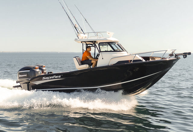 A cabin boat cruising on the water, representing powered by reliable trollling motor battery system