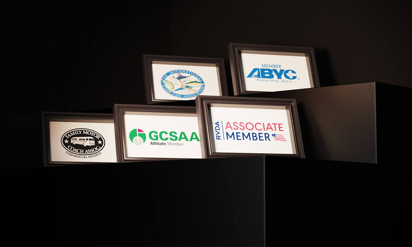 A display of framed industry certifications like RVIA and ABYC, representing LiTime's expert-backed quality